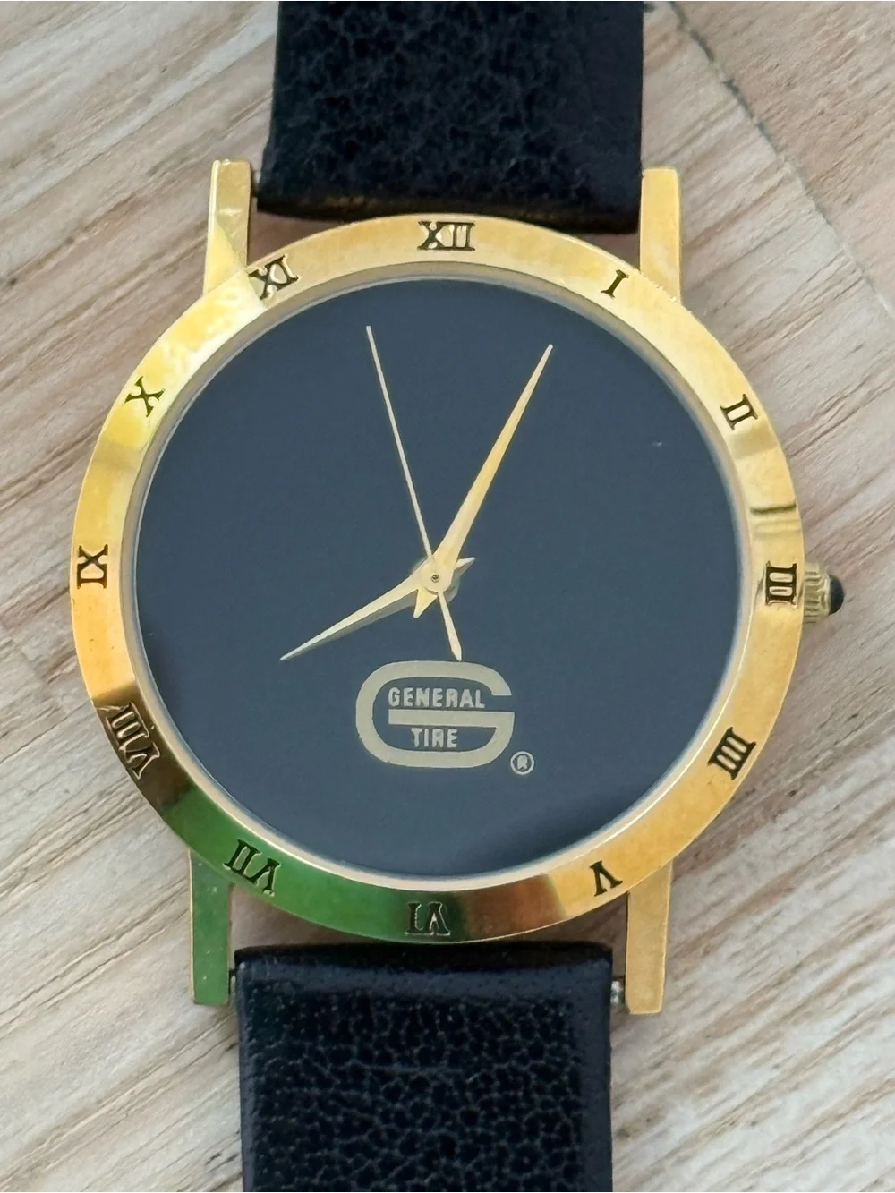 General Tire Dress Watch Black Dial Leather Strap Gold-Tone Case Hands